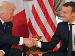 Footage of a handshake between US President Donald Trump and French counterpart Emmanuel Macron ahead of a NATO summit. (AFP/Mandel NGAN)