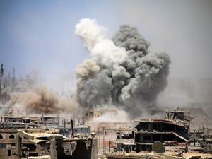 Smoke rises from buildings following a reported air strike on a rebel-held area in the southern Syrian city of Daraa, on May 22, 2017. (AFP/Mohammed Abazeed)