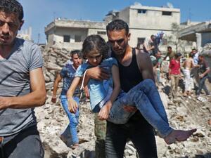 SNC Urges international community to denounce the crimes against Syrians committed in the southwestern Daraa. (AFP/Ahmad al-Msalam)