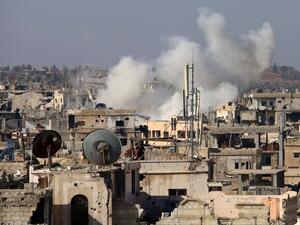 Smoke billows following reported shelling by Syrian government forces in the rebel-held area of Deraa, in southern Syria, on January 18, 2017. (AFP/Mohamad Abazeed)