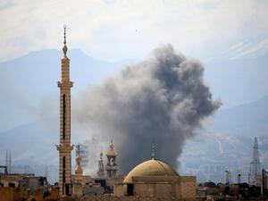 Smoke billows following a reported air strike in the rebel-held parts of the Jobar district, on the eastern outskirts of the Syrian capital Damascus, on March 20, 2017. (AFP/Amer Almohibany)