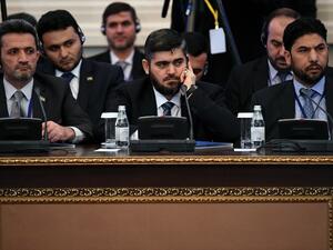 Chief opposition negotiator Mohammad Alloush (C) of the Jaish al-Islam (Army of Islam) rebel group attends the first session of Syria peace talks at Astana's Rixos President Hotel on January 23, 2017. (AFP/Kiril Kudryatsev)
