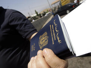 Many Syrians left the country illegally, making them unable to renew their passports and leaving them trapped in their host countries. (AFP/File)