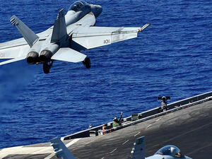 An F-18 takes off from the US Navy's USS Dwight D. Eisenhower to carry out air strikes on 7 July 2016. (AFP)