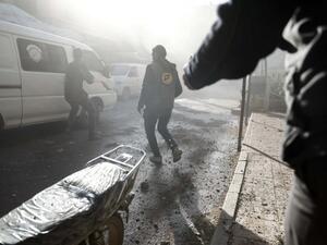 Syrian civil defense volunteers, known as the White Helmets, search for survivors following reported government airstrike on the rebel-held town of Douma, east of Damascus, on February 19, 2017. (AFP/Sameer al-Doumy)