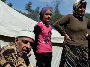 Syrian Turkmen at a camp on the border. (AFP/File) Syrian Turkmen at a camp on the border. (AFP/File)