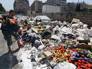 An estimated 300,000 tons of trash have been festering in Lebanon's streets since July. (AFP/File)