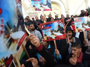 Tunisians protest against Israel on Tuesday (Fethi Belaid/AFP)