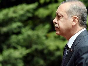 TURKEY, Ankara : Turkish Prime Minister Recep Tayyip Erdogan walks to his office in Ankara on August 19, 2013. AFP PHOTO/ADEM ALTAN
