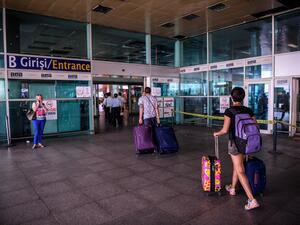 Passengers enter the Ataturk airport International arrival terminal a day after a suicide bombing and gun attack targeted Istanbul's airport, killing at least 36 people.   (AFP/Ozan Kose)