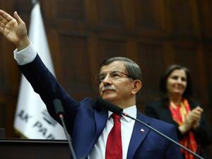 Turkish Prime Minister and leader of Turkey's ruling party, the Justice and Development Party (AKP) Ahmet Davutoglu greets members of parliament on May 03, 2016. (AFP/Adem Altan)