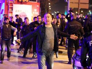 A man reacts next to policemen near the site of an explosion. (AFP/File)
