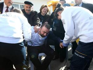 Family members and relatives mourn outside a morgue in Ankara on February 18, 2016, a day after a car bombing targeted military vehicles, killing 28. (AFP/Adem Altan)