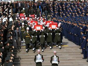 Honor guards carry the coffins of eight victims of the terror attack at Friday's funerals at Ankara's Kocatepe Mosque. (AFP/File)