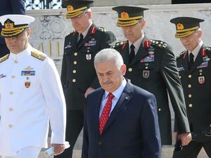 Turkey's Prime Minister Binali Yildirim (C) and members of Turkish Supreme Military Council (YAS) are seen during their visit at Anitkabir, mausoleum of Mustafa Kemal Ataturk in Ankara, on July 28, 2016. (AFP/Adem Altan)