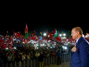 Turkish President Recep Tayyip Erdogan addresses people gathered at the Presidential Complex to protest the July 15th failed military coup attempt in Ankara, Turkey on August 10, 2016. (AFP/Kayhan Ozer)