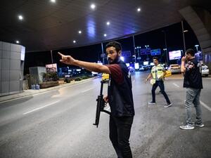 A Turkish police officer reacts at Ataturk airport`s main gate on June 28, 2016 in Istanbul after two explosions followed by gunfire hit Turkey's biggest airport. (AFP/Ozan Kose)