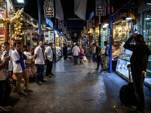 People walk inside the spice bazaar in Eminonu district, in Istanbul on June 9, 2016. (AFP/Ozan Kose)