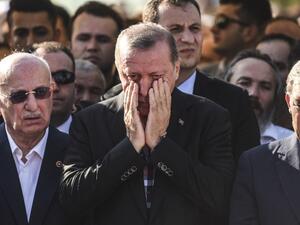 Turkey's President Recep Tayyip Erdogan reacts after attending the funeral of a victim of the coup attempt in Istanbul on July 17, 2016. (AFP/Bulent Kilic)