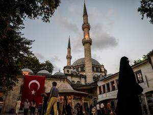 A Turkish national flag is seen on Eyup sultan mosque on July 26, 2016 in Eyup district in Istanbul, following the failed military coup attempt of July 15. (AFP/Ozan Kose)
