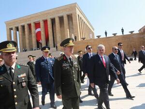 Turkey's Prime Minister Binali Yildirim (3-L) and Chief of the General Staff of the Turkish Armed Forces, Hulusi Akar (2-L) are seen during Turkish Supreme Military Council (YAS) members' visit at Anitkabir, mausoleum of Mustafa Kemal Ataturk in Ankara, on July 28, 2016. (AFP/Adem Altan)