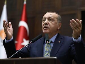 Turkish President Tayyip Erdogan addresses members of parliament of his ruling AK Party (AKP) during a meeting at the Turkish parliament in Ankara. (AFP/File)