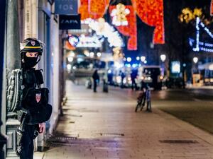 A French police officer stands guard near the scene of a shooting on December 11, 2018 in Strasbourg, eastern France. (Abdesslam MIRDASS / AFP)