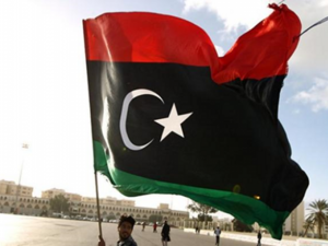 A man waves the Libyan flag. (AFP/File Photo)