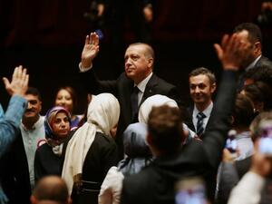 Turkish President Recep Tayyip Erdogan waves to supporters during a ceremony marking the last year's failed coup. (Adem Altan/AFP)