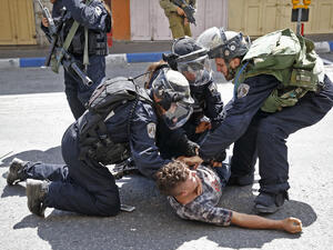 Israeli forces arrest a Palestinian youth during clashes between demonstrators and security forces in the city of Hebron in the Israeli-occupied West Bank. (AFP) 
