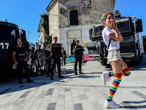 Turkish riot police officers block ways to Istikjlal avenue for LGBT rights activist (C) as they try to gather for a pride parade, which was banned by the governorship, in central Istanbul, on June 25, 2017. (Bulent Kilic/AFP)