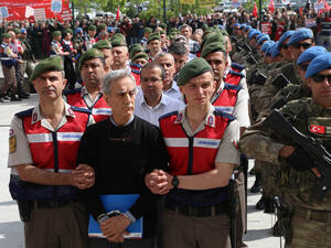 Turkish Gendarmerie escorting defendants Akin Ozturk (2L) and others involved in last July’s attempted coup in Turkey as they leave the prison where they are being held. (AFP) 