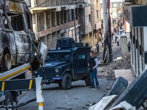 This file photo taken on October 05, 2015 shows a Turkish police officer stand guarding a street in Silvan, after clashes between Turkish army and Kurdish rebels. (AFP/Ilyas Akengin)