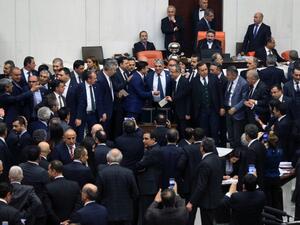 Turkish lawmakers cast their votes during a debate for a proposal for change in the constitution on January 10, 2017 at the Turkish parliament in Ankara.  (AFP/Adem Altan)