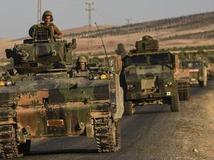 This file photo taken on September 02, 2016 shows Turkish soldiers driving back to Turkey from the Syrian-Turkish border town of Jarabulus. (AFP/Bulent Kilic)