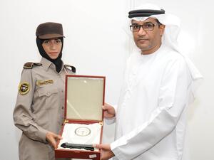 CEO of Himaya Security Colonel Ahmed Mohamed Al Hantoubi with a graduate of the first batch of female security guards at the National Security Institute in Abu Dhabi. (UAE Ministry of Interior) CEO of Himaya Security Colonel Ahmed Mohamed Al Hantoubi with a graduate of the first batch of female security guards at the National Security Institute in Abu Dhabi. (UAE Ministry of Interior)