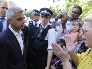 Prime Minister Theresa May and London Mayor Sadiq Khan visited the scene of the deadly blaze on Thursday, promising a full investigation into the catastrophe. (AFP)