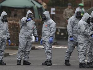 Military personnel wearing protective coveralls work behind a police station in Salisbury following an attack on a former Russian spy by a nerve agent. (AFP/ File Photo)