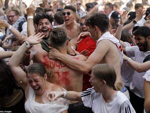 These fans in London could be seen cheering wildly and throwing beer around as Dele Alli added a second goal for England against Sweden. (AFP/ File Photo)