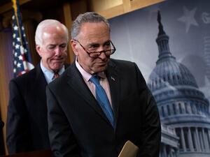 Sen. John Cornyn (R-TX) and Sen. Chuck Schumer (D-NY) exit a news conference concerning the Justice Against Sponsors of Terrorism Act (JASTA), on Capitol Hill, May 17, 2016, in Washington, DC. (AFP/Getty Images/Drew Angerer)