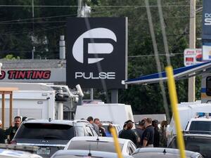 Orlando police officers seen outside of Pulse nightclub after a fatal shooting and hostage situation on June 12, 2016 in Orlando, Florida. (AFP/Gerardo Mora)