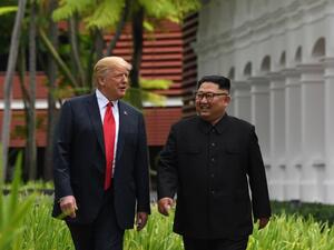 US President Donald Trump (L) and North Korea's leader Kim Jong Un (R) during Singapore Summit on on June 12, 2018. (AFP/ File)