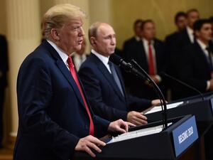 US President Donald Trump and Russia's President Vladimir Putin attend a joint press conference after a meeting at the Presidential Palace in Helsinki, on July 16, 2018. (Brendan SMIALOWSKI/ AFP)