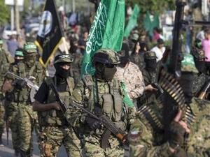 Fighters from al-Qassam Brigades, the military wing of Hamas resistance movement, take part in a parade in Gaza City. (AFP)
