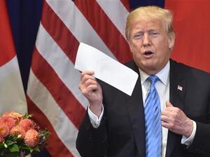 US President Donald Trump shows a letter he said he received the previous day from North Korean leader Kim Jong-un, on September 26, 2018. (AFP/File)