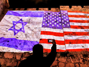 The American and Israeli flags projected onto Jerusalem's Old City Walls. Ahmad Gharabli/AFP