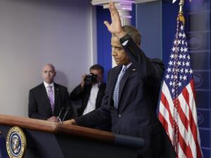 Outgoing US President Barack Obama waves goodbye at his final press conference at the White House on January 18, 2017.(AFP/Yuri Gripas)  Outgoing US President Barack Obama waves goodbye at his final press conference at the White House on January 18, 2017.(AFP/Yuri Gripas)