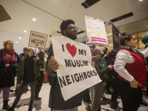 A protestor demonstrates against the new ban on immigration issued by President Donald Trump at Logan International Airport, Boston on January 28, 2017. (AFP/Scott Eisen)