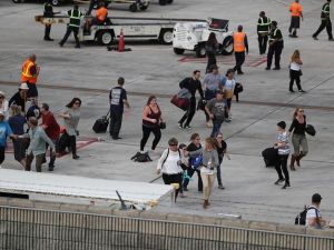 Travelers are evacuated out of the terminal and onto the tarmac after airport shooting at Fort Lauderdale in Florida. (AFP/File)