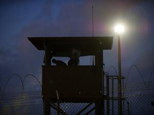 In this March 30, 2010 file photo reviewed by US military officials, a member of the US military mans the guard post before sunrise at Camp Delta, part of the US Detention Center in Guantanamo Bay, Cuba. (AFP/Paul J. Richards)